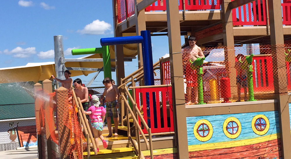 Kids playing on the play structure at Yogi Bear's Jellystone Park
